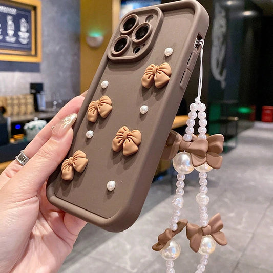 Korean 3D Bow Pearl Phone Case for iPhone 17, 16, 15, 14, 13 & 12 Pro Max | Cute Silicone Case with Lanyard