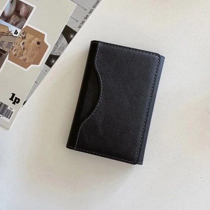 MagSafe leather wallet case in black color, featuring sleek design and card storage functionality.