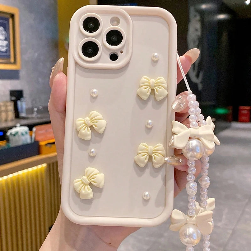 Korean 3D Bow Pearl Phone Case for iPhone 17, 16, 15, 14, 13 & 12 Pro Max | Cute Silicone Case with Lanyard