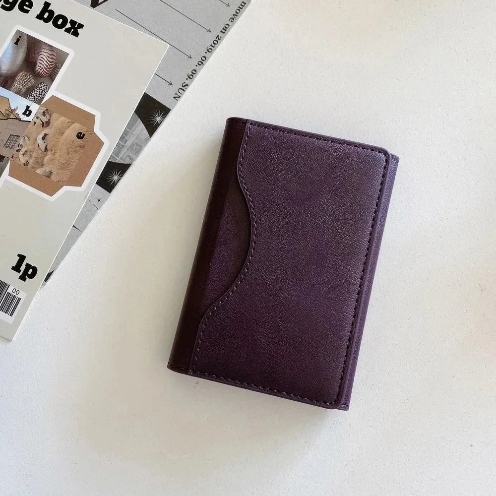 MagSafe leather wallet case in stylish purple color, designed for practicality and modern aesthetics.